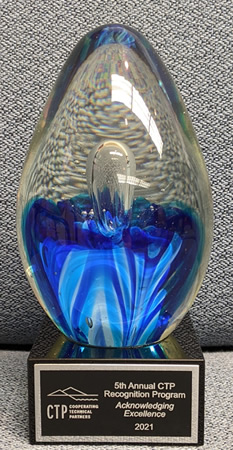 blue and clear, ovoid glass award with plaque on base 