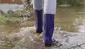 galoshes walking through a puddle