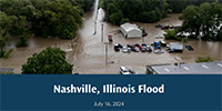 East St. Louis Street in Nashville, IL with floodwater flowing over it